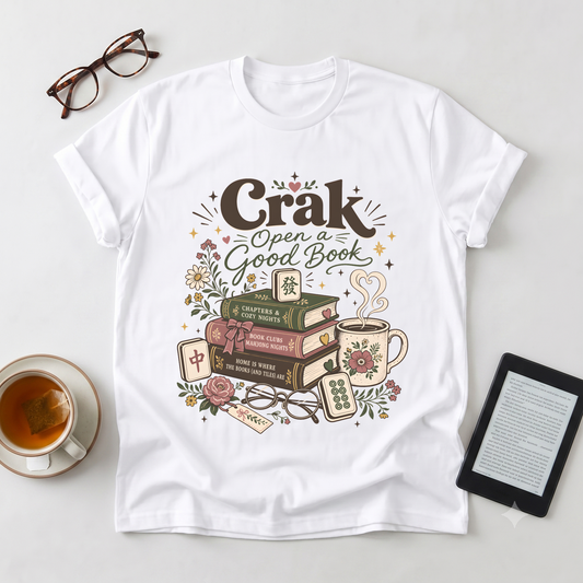 Book Lover T‑Shirt — "Crak Open a Good Book" Vintage Stack & Tea Graphic